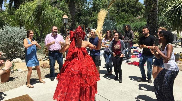 brazilian dancer performs in front of the grove house